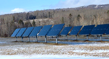 Empty field filled with large solar panels.