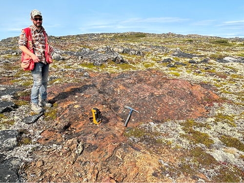 GEM-GeoNorth scientist Jessey Rice at one of the newly discovered mineralization sites in the Black Islands